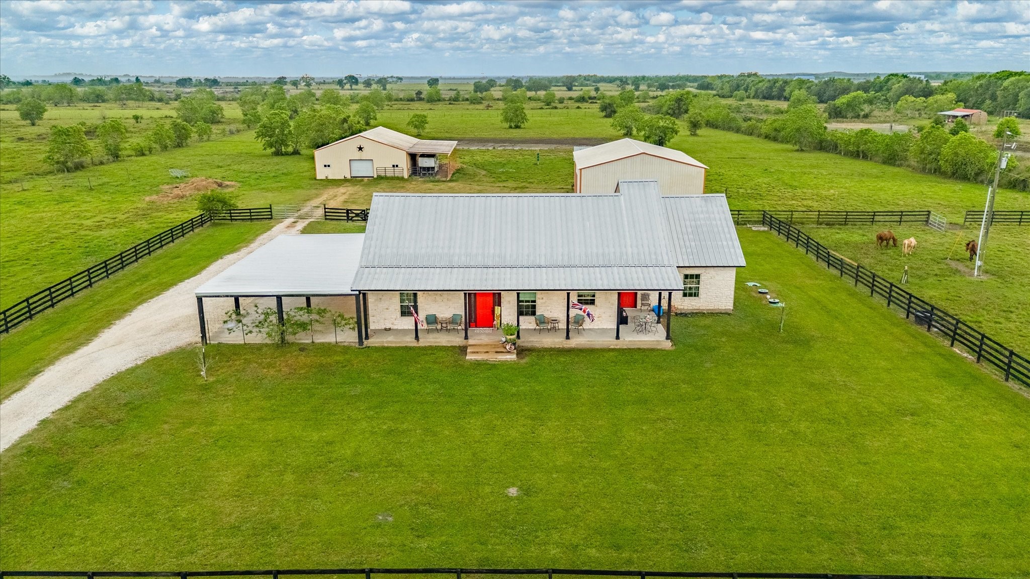 1755 McBride-Devillier Loop Winnie, TX 77665 - Photo 43 of 44 an aerial view of a house with a garden