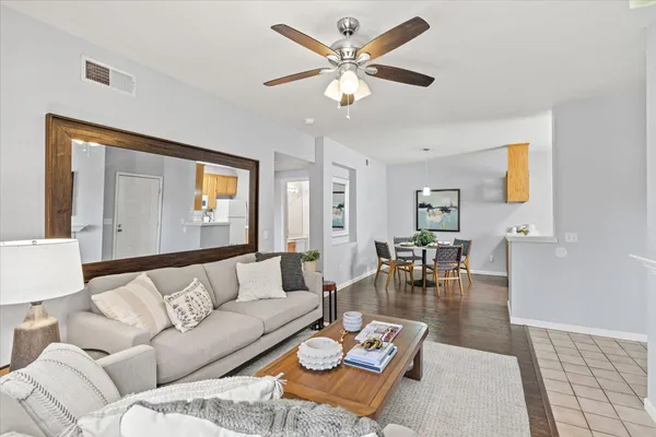 a living room with furniture and a large window