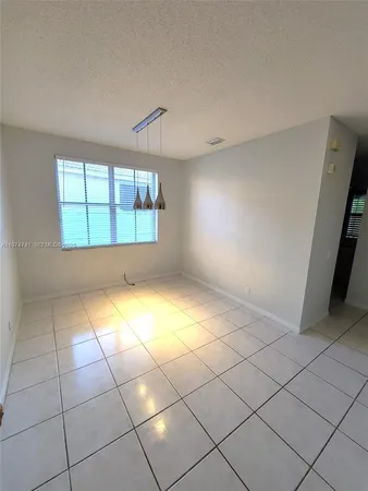 a view of kitchen with furniture and white appliances