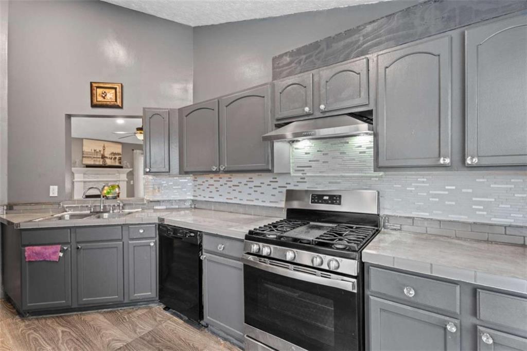 336 Shenandoah Circle Winder, GA 30680 - Photo 12 of 41 a kitchen with stainless steel appliances granite countertop a stove and a sink