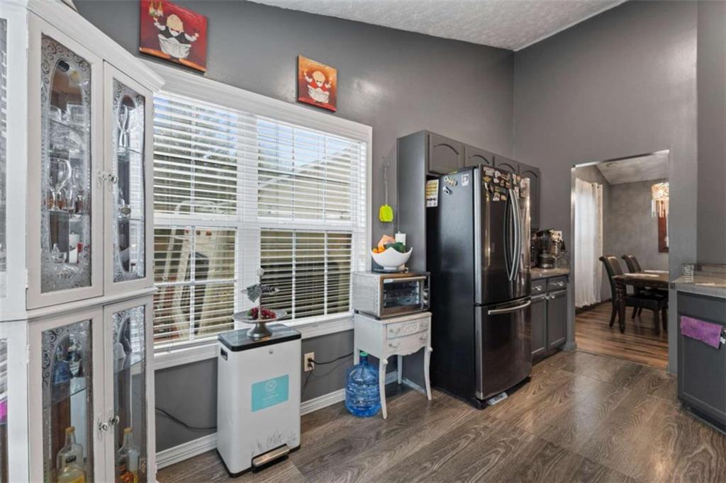 336 Shenandoah Circle Winder, GA 30680 - Photo 13 of 41 a kitchen with stainless steel appliances kitchen island granite countertop a refrigerator and a stove top oven