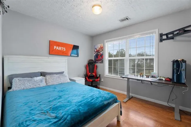 a bedroom with furniture and a window