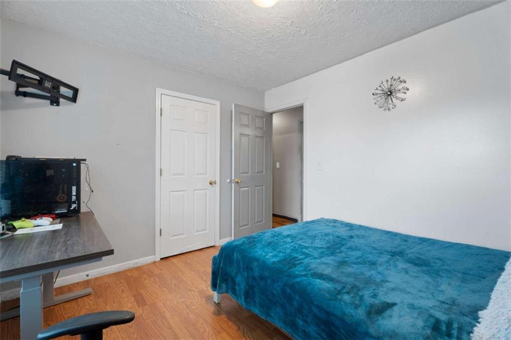 336 Shenandoah Circle Winder, GA 30680 - Photo 18 of 41 a bedroom with a bed and flat screen tv