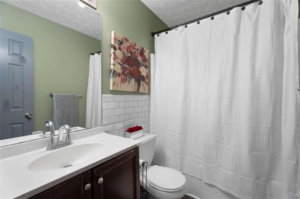 336 Shenandoah Circle Winder, GA 30680 - Photo 19 of 41 a bathroom with a sink and a mirror