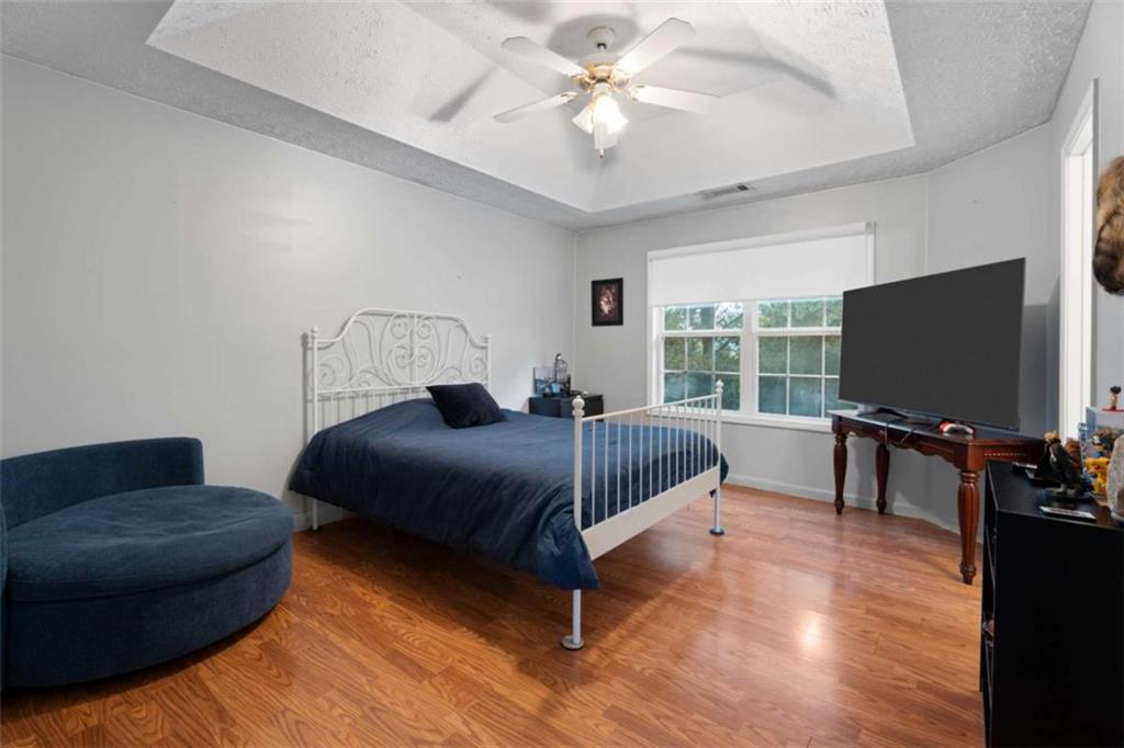 336 Shenandoah Circle Winder, GA 30680 - Photo 20 of 41 a bedroom with a bed and a flat screen tv