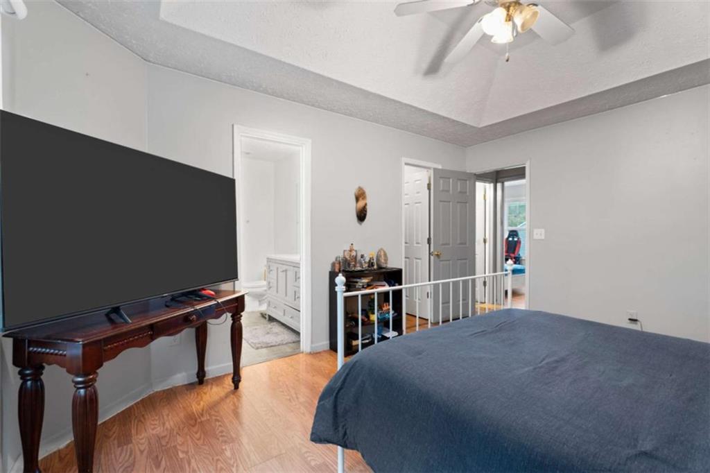 336 Shenandoah Circle Winder, GA 30680 - Photo 21 of 41 a bedroom with a bed and a flat screen tv