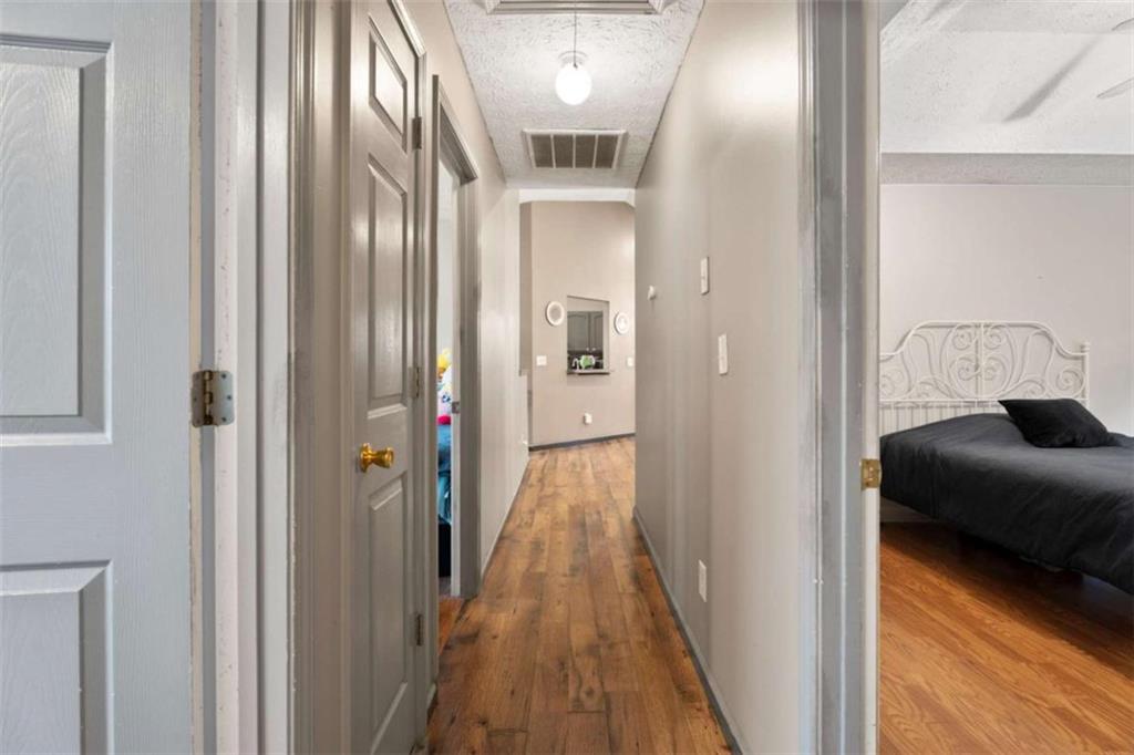 336 Shenandoah Circle Winder, GA 30680 - Photo 26 of 41 a view of a hallway with wooden floor and staircase