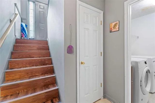 a view of entryway with furniture and wooden floor