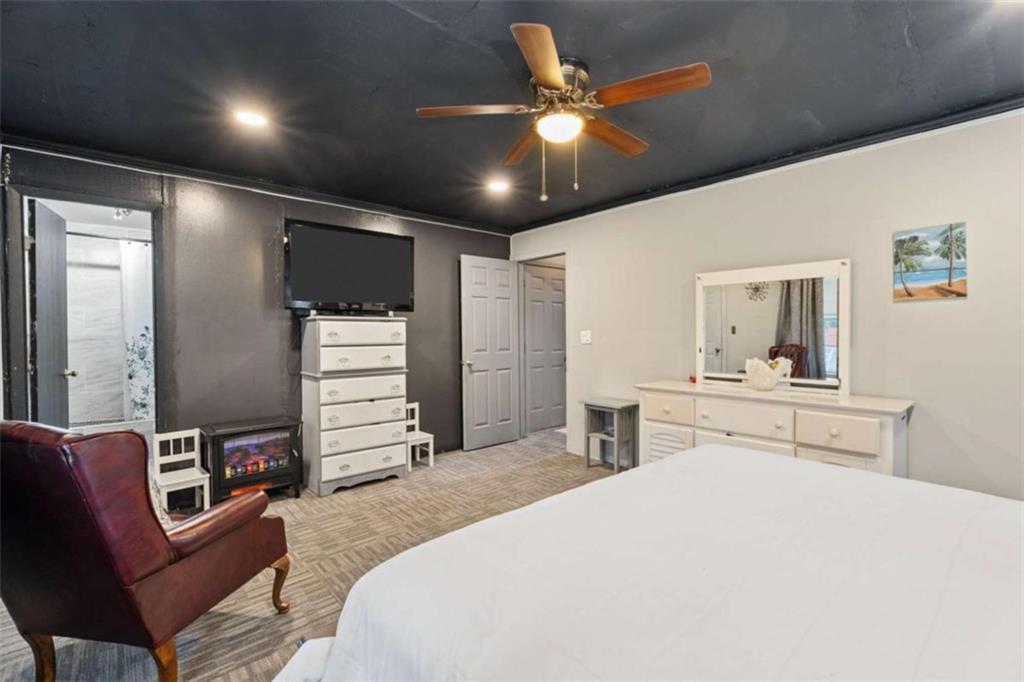 336 Shenandoah Circle Winder, GA 30680 - Photo 30 of 41 a bedroom with a bed and a chandelier