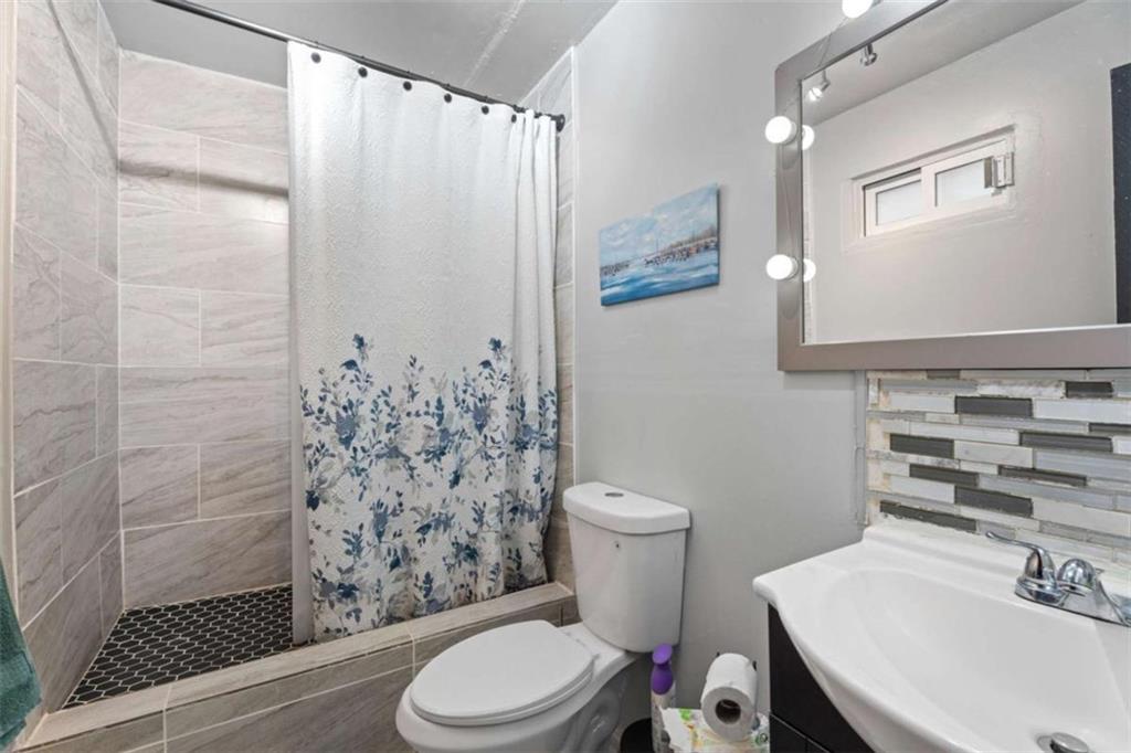 336 Shenandoah Circle Winder, GA 30680 - Photo 31 of 41 a white toilet sitting next to a bathroom sink