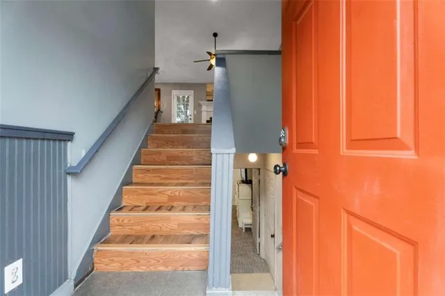 a view of staircase with white walls and windows