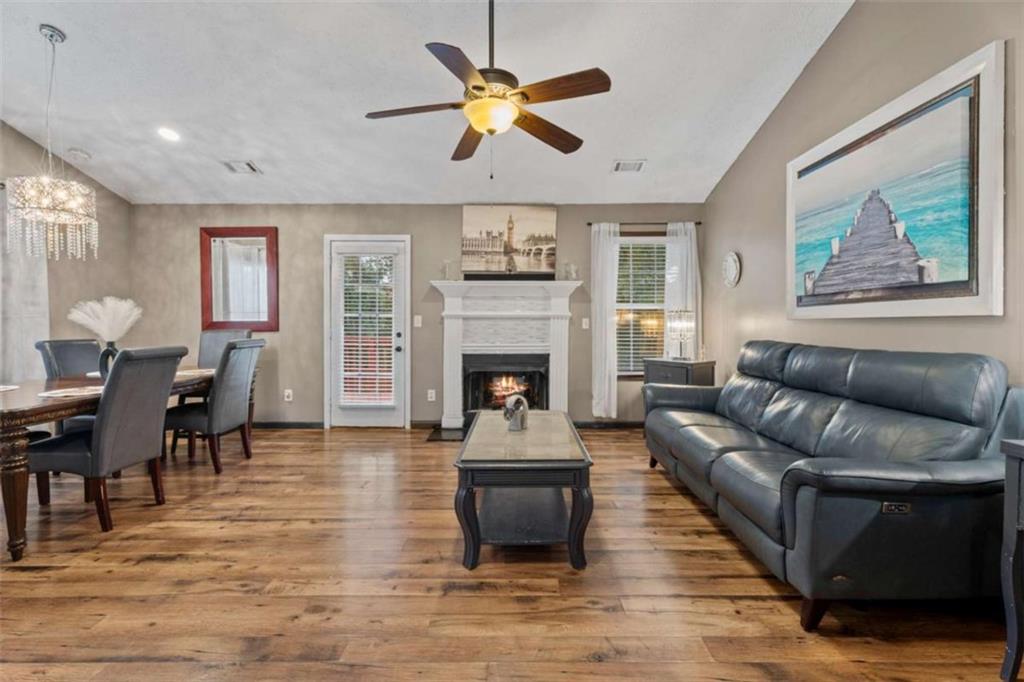 336 Shenandoah Circle Winder, GA 30680 - Photo 7 of 41 a living room with furniture and a fireplace