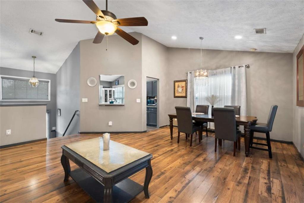336 Shenandoah Circle Winder, GA 30680 - Photo 10 of 41 a living room with furniture a dining table and wooden floor