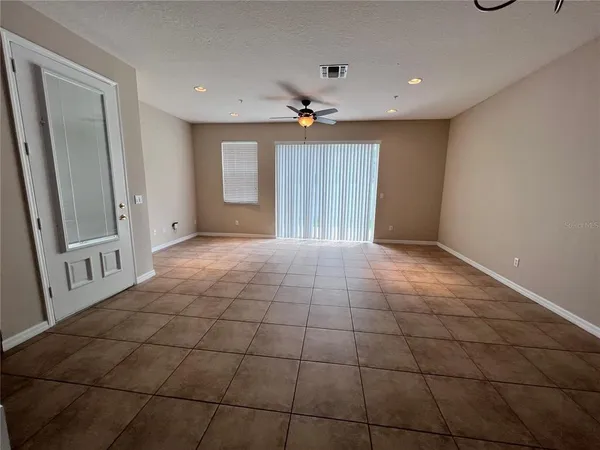 a view of an empty room with a window
