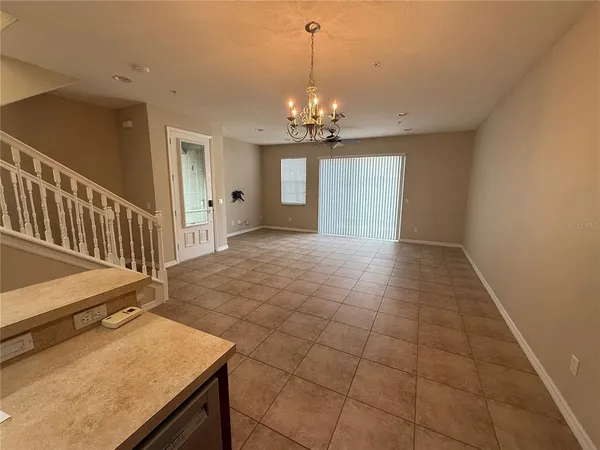 a kitchen with a refrigerator sink and cabinets