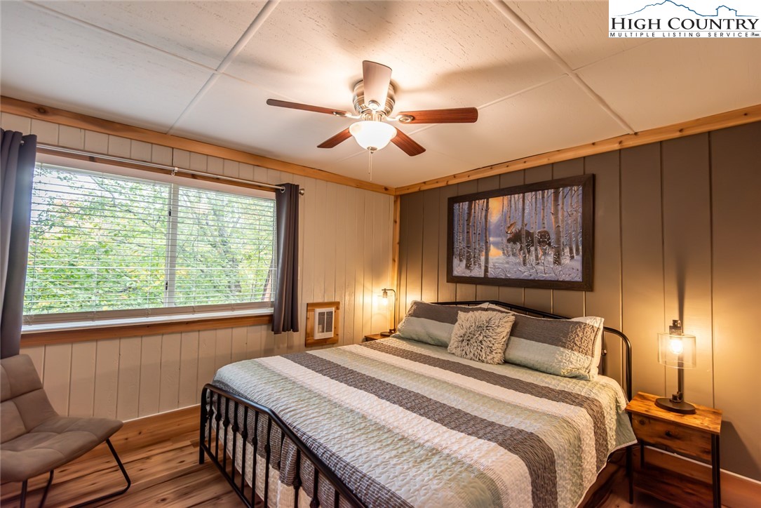 220 Charter Hills Road, Unit A2 Beech Mountain, NC 28604 - Photo 16 of 30 a bedroom with a large bed and a window