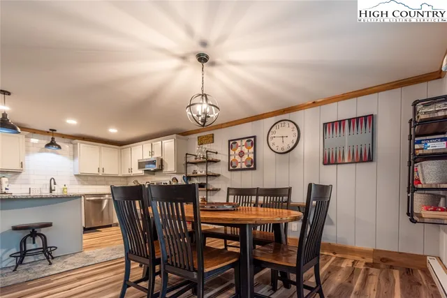 a view of a field with trees in the background