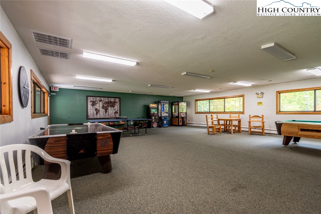220 Charter Hills Road, Unit A2 Beech Mountain, NC 28604 - Photo 29 of 30 a living room with furniture and a flat screen tv