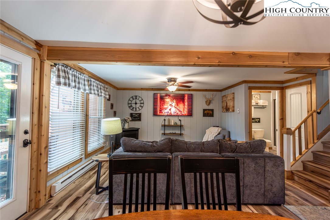 220 Charter Hills Road, Unit A2 Beech Mountain, NC 28604 - Photo 6 of 30 a living room with furniture a flat screen tv and a potted plant