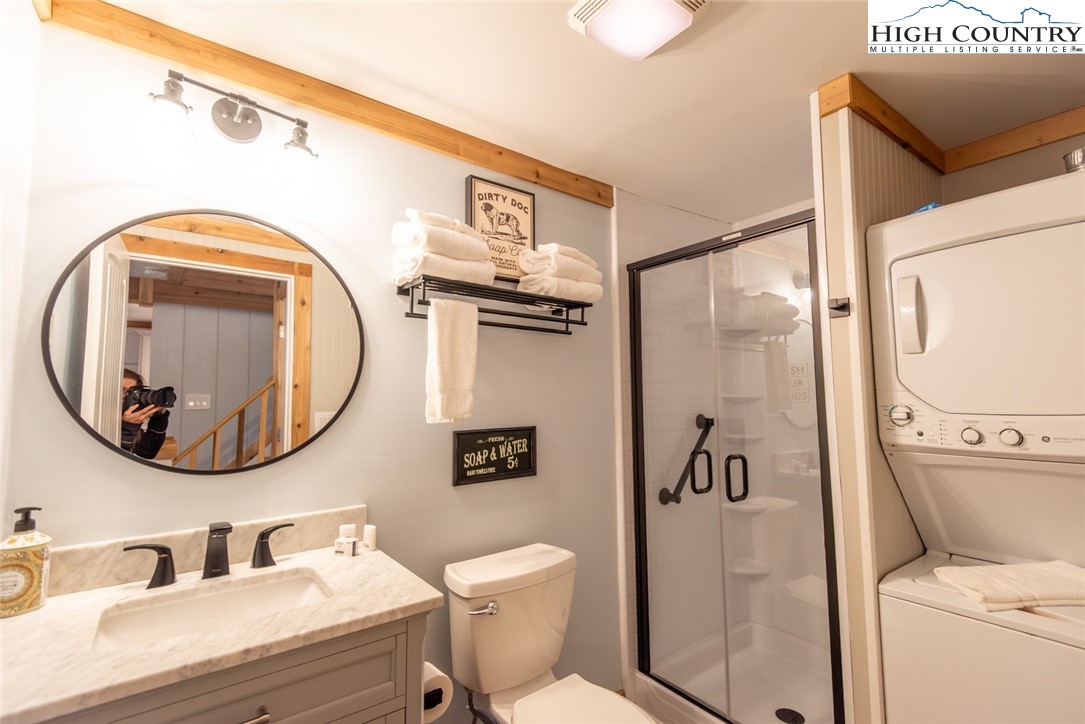 220 Charter Hills Road, Unit A2 Beech Mountain, NC 28604 - Photo 9 of 30 a bathroom with a toilet a sink and a mirror