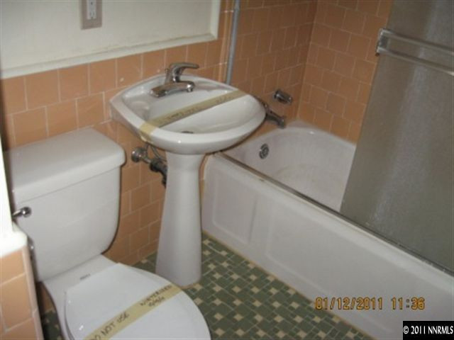 901 Delmar Way Reno, NV 89509 - Photo 4 of 10 a bathroom with a sink toilet and shower