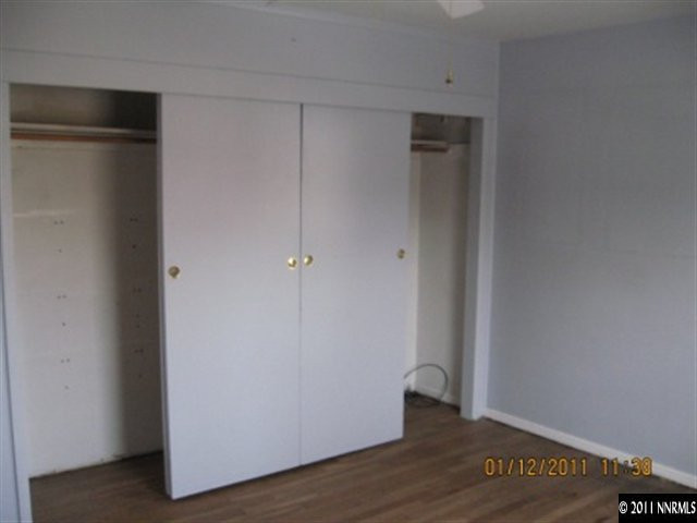 901 Delmar Way Reno, NV 89509 - Photo 6 of 10 a view of an empty room with wooden floor
