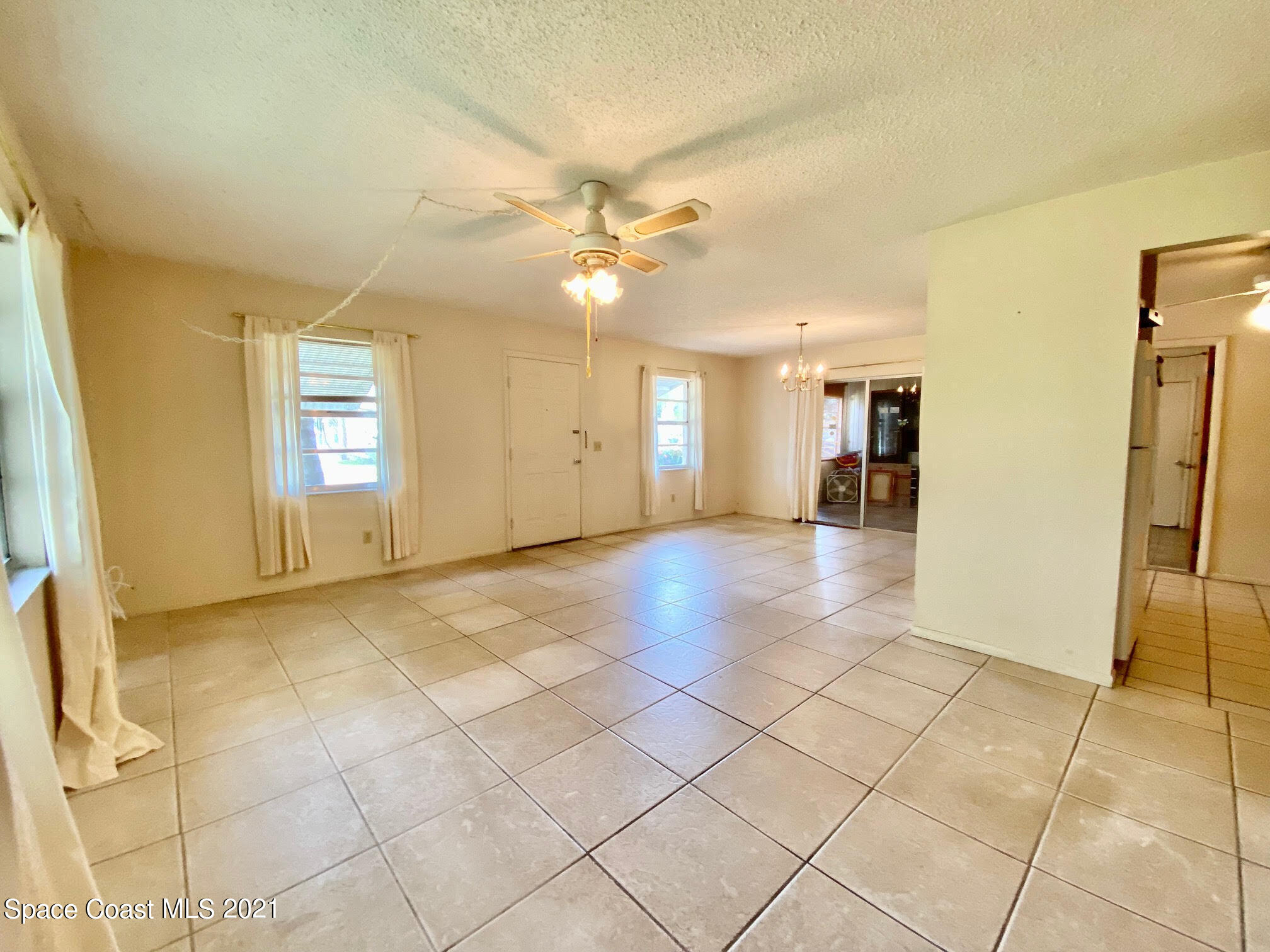 2933 Lancaster Road Melbourne, FL 32935 - Photo 3 of 25 a view of a livingroom with a staircase