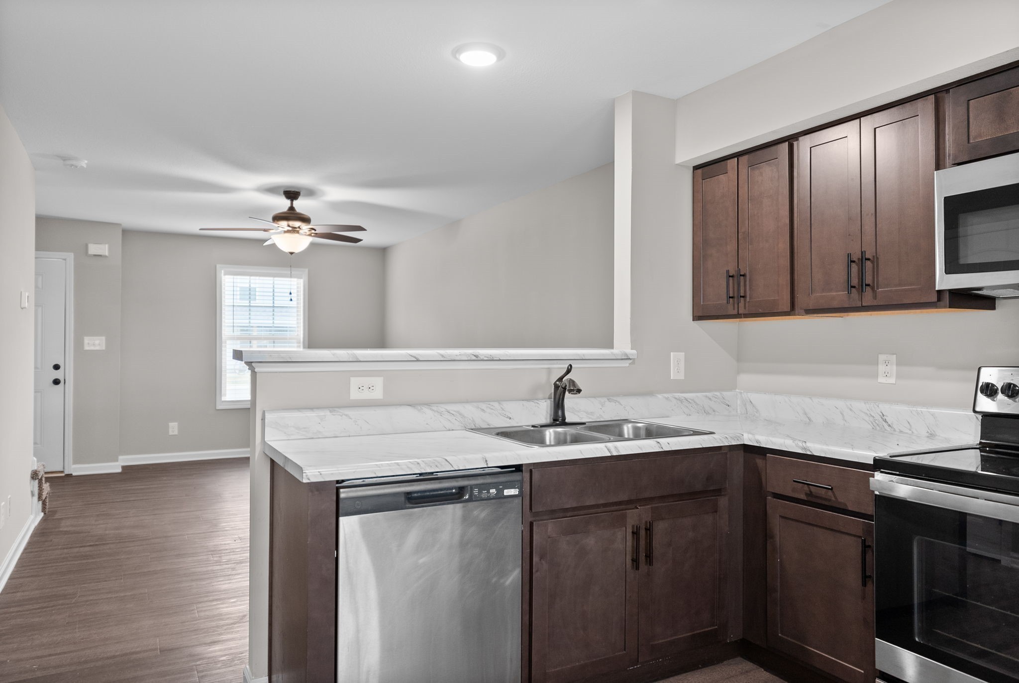 418 Peachers Mill Road, Unit C6 Clarksville, TN 37042 - Photo 8 of 21 a kitchen with a sink cabinets and wooden floor