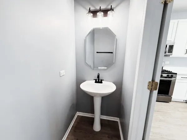 a bathroom with a sink and a mirror