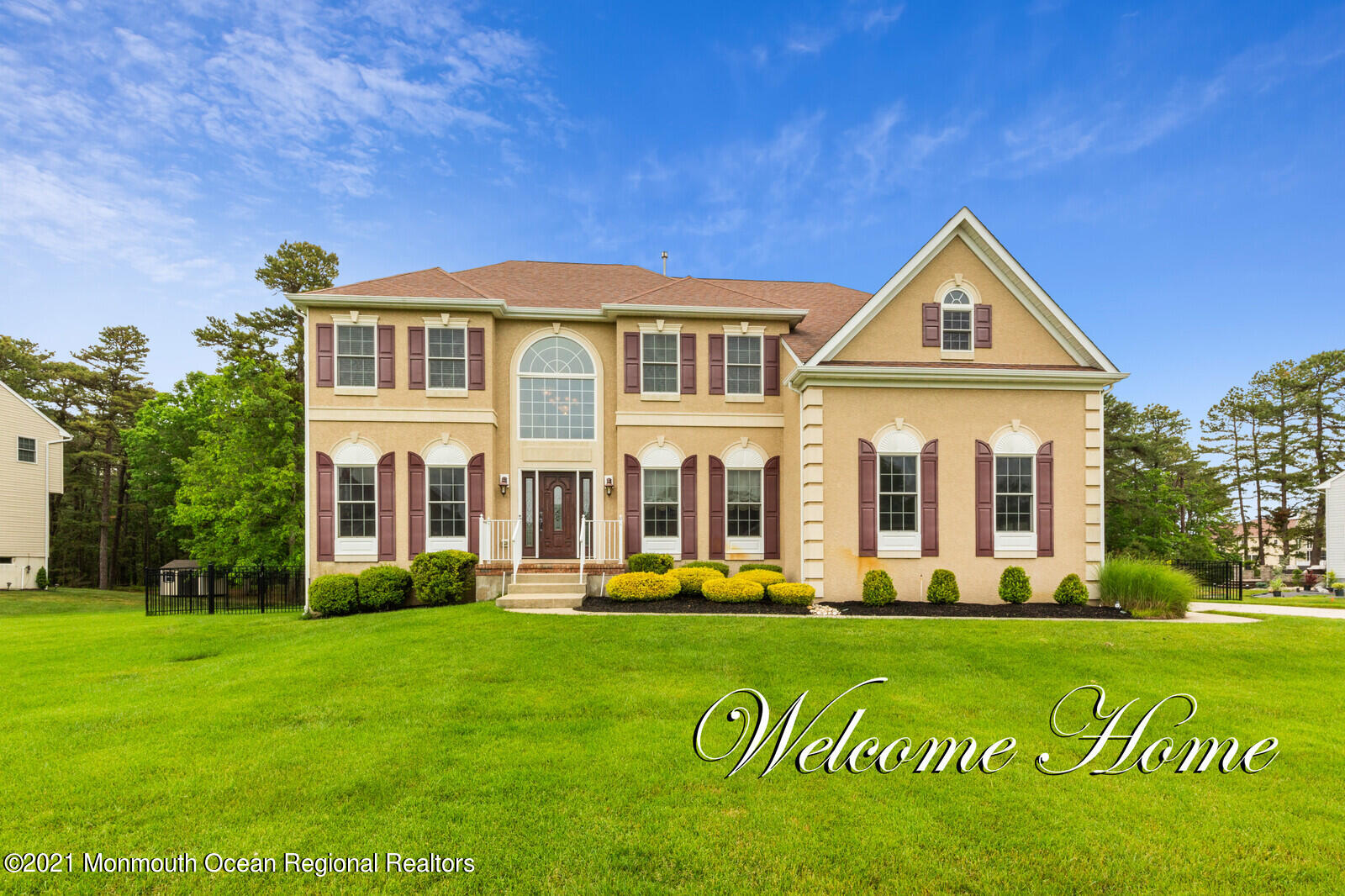 124 Adams Way Jackson, NJ 08527 - Photo 2 of 62 a front view of a house with a garden