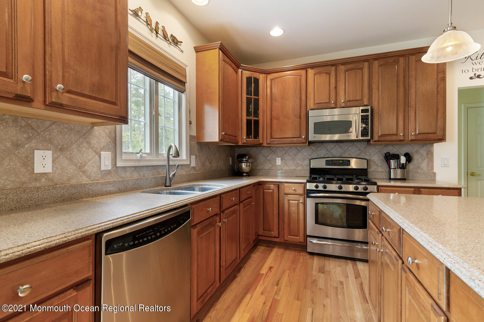 124 Adams Way Jackson, NJ 08527 - Photo 14 of 62 a kitchen with stainless steel appliances granite countertop a sink a stove a microwave cabinets and a window