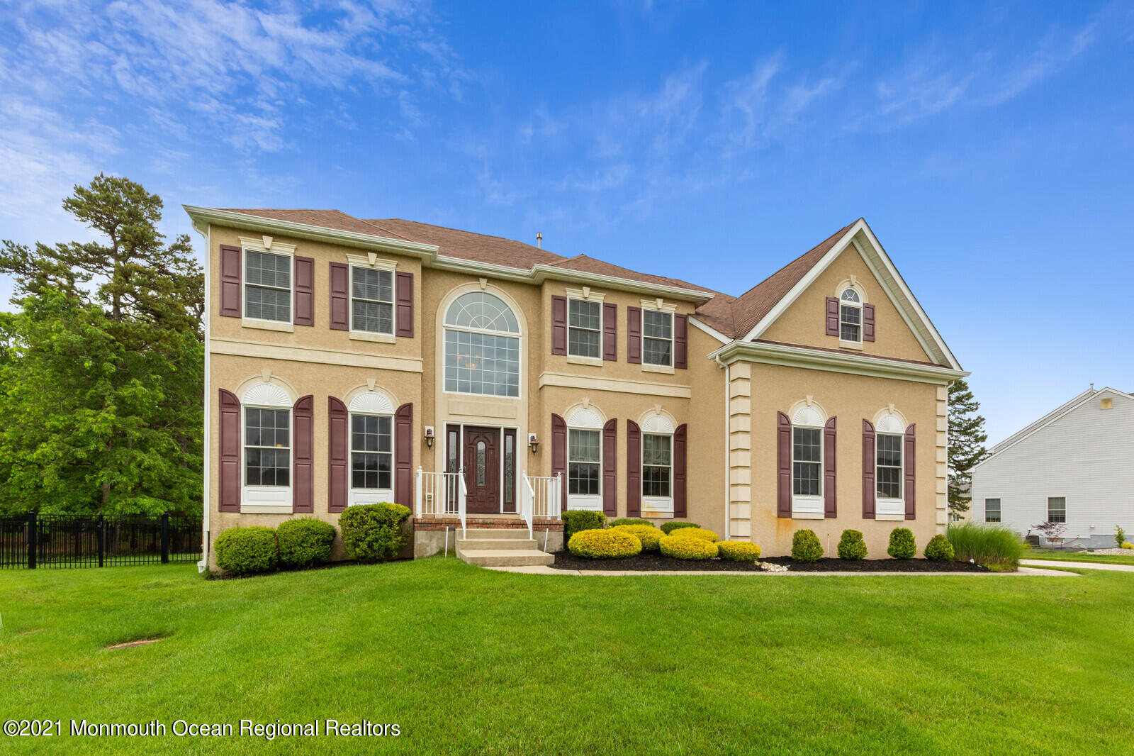 124 Adams Way Jackson, NJ 08527 - Photo 3 of 62 a front view of a house with a garden and porch