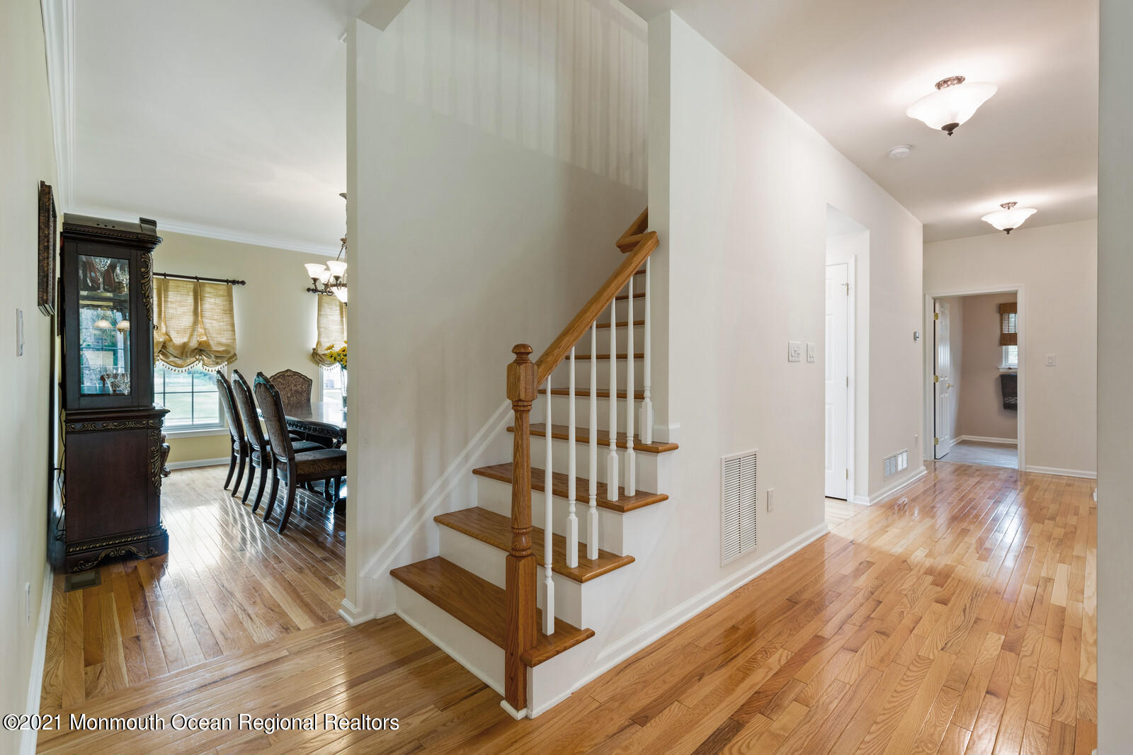 124 Adams Way Jackson, NJ 08527 - Photo 29 of 62 a view of entryway with dining room and wooden floor
