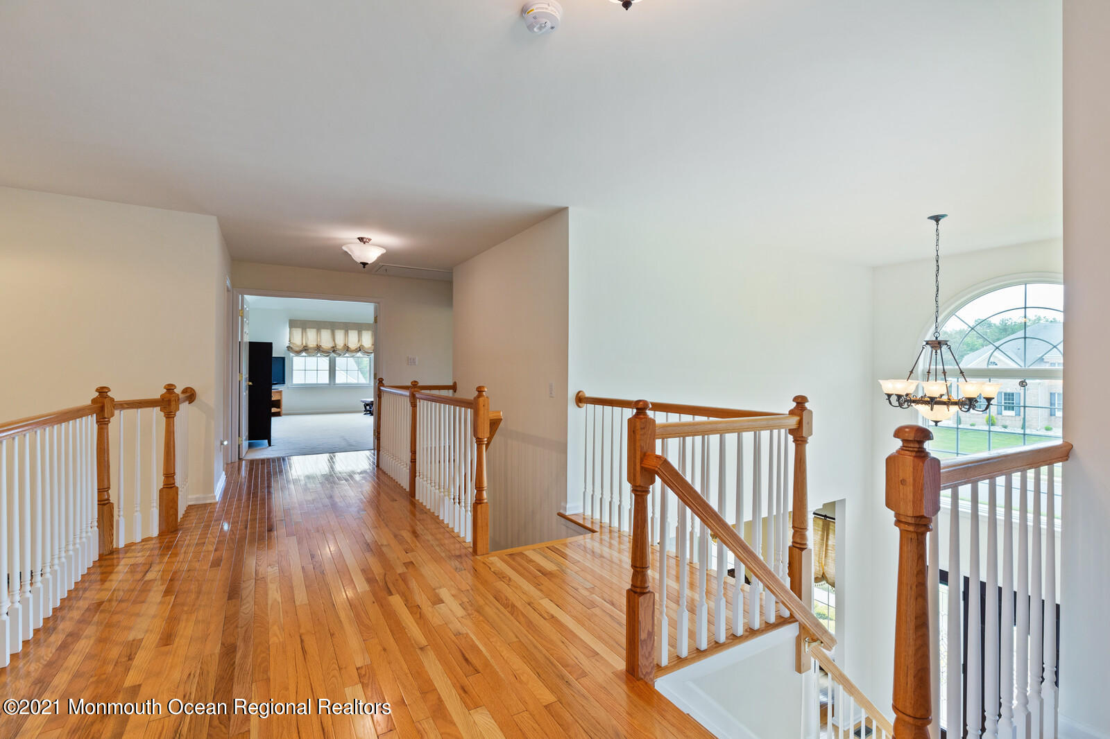124 Adams Way Jackson, NJ 08527 - Photo 31 of 62 a view of hallway with wooden floor and stairs