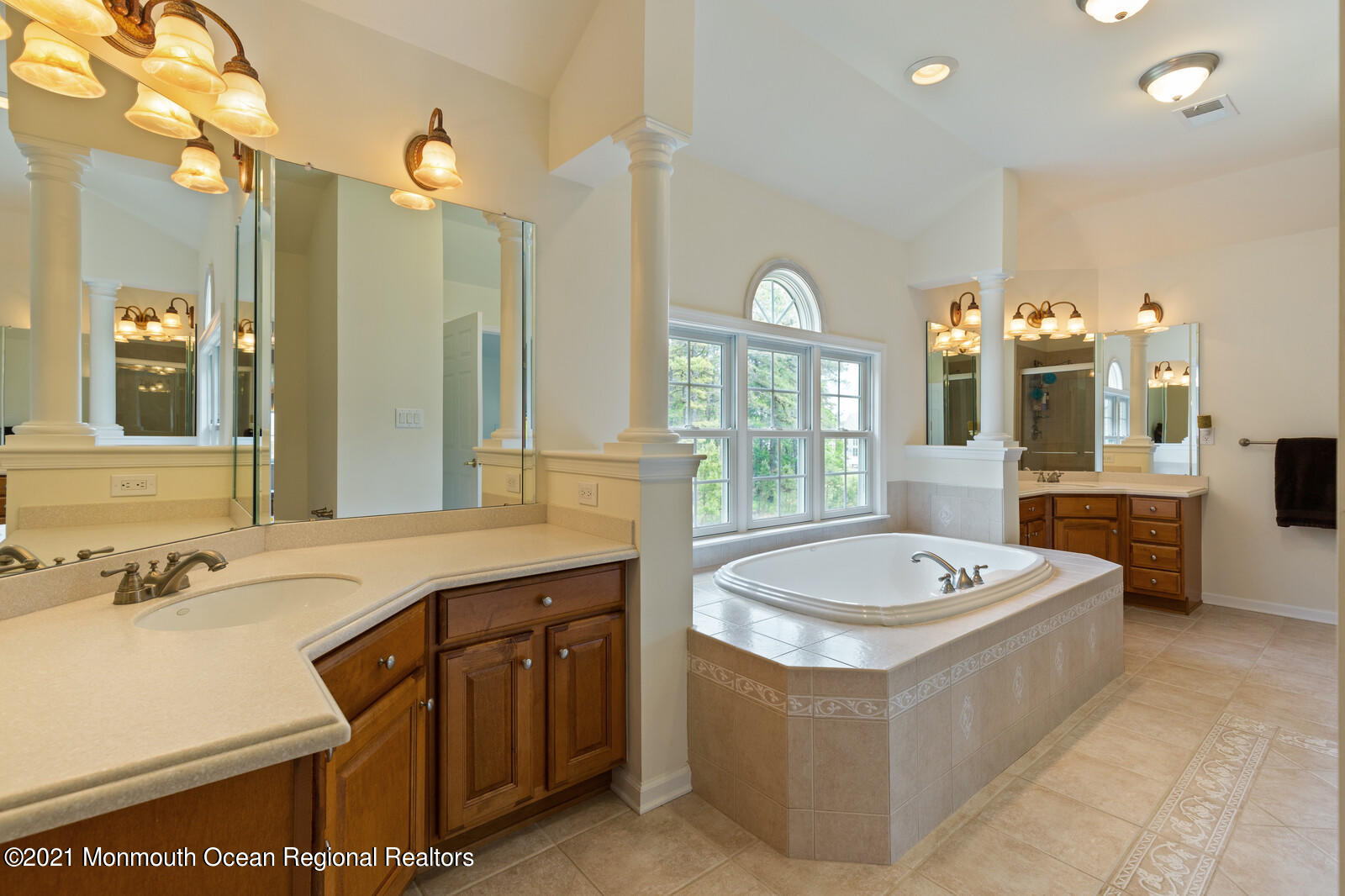 124 Adams Way Jackson, NJ 08527 - Photo 37 of 62 a bathroom with a sink a tub a mirror and a shower