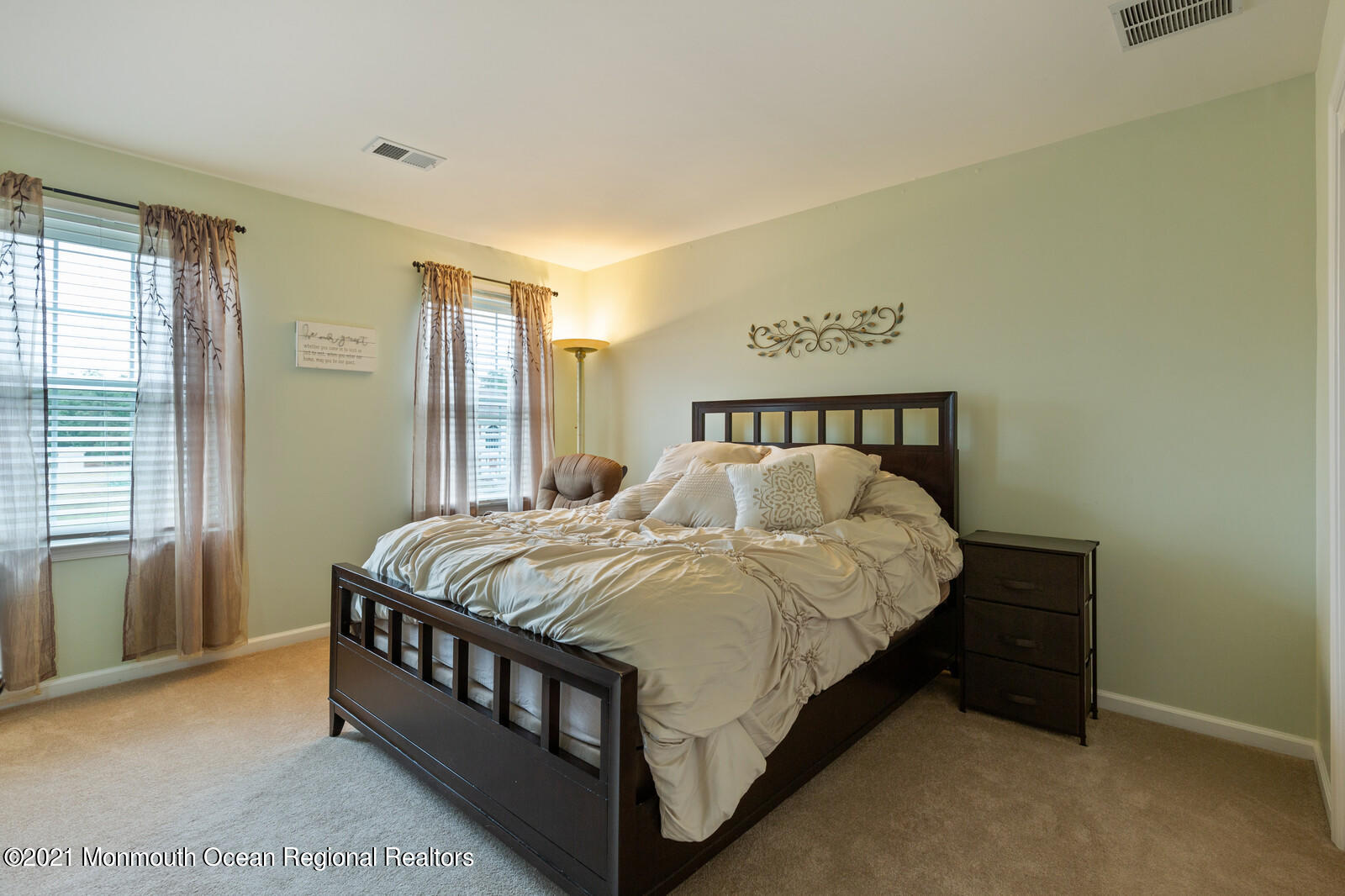 124 Adams Way Jackson, NJ 08527 - Photo 40 of 62 a bed sitting in a bedroom next to a window