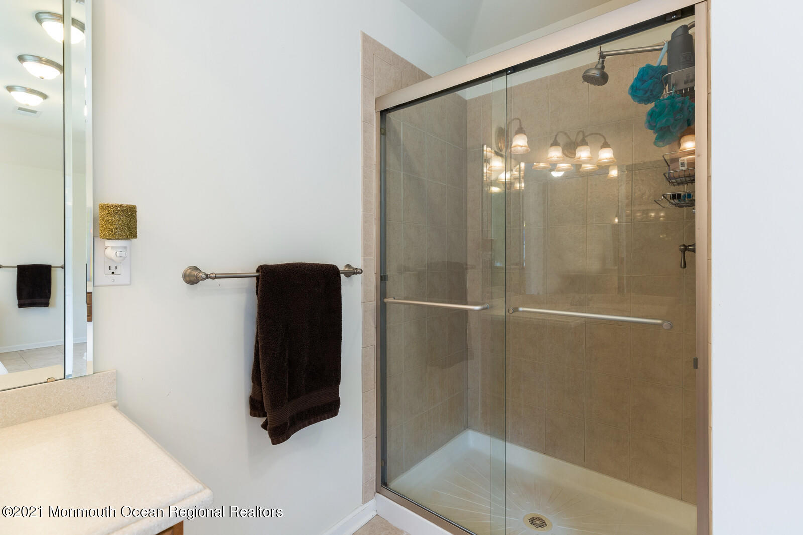 124 Adams Way Jackson, NJ 08527 - Photo 42 of 62 a bathroom with a glass shower door