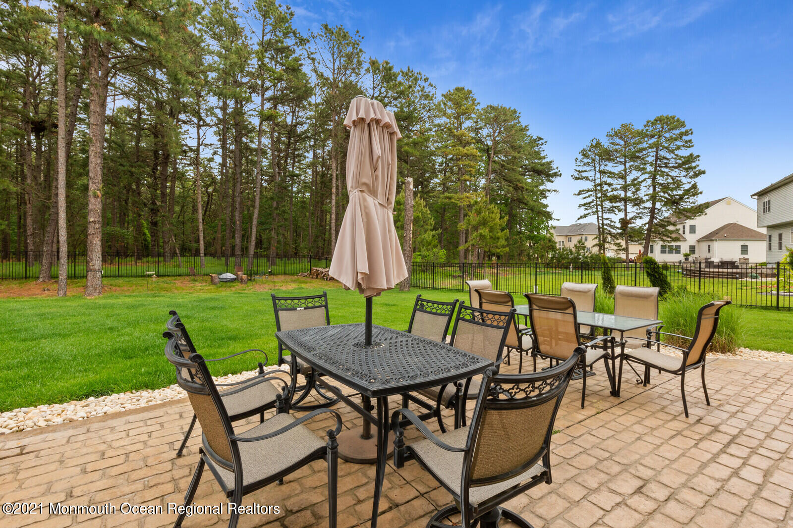 124 Adams Way Jackson, NJ 08527 - Photo 47 of 62 a view of a chairs and table in backyard of the house