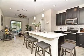 a kitchen with counter space appliances and cabinets
