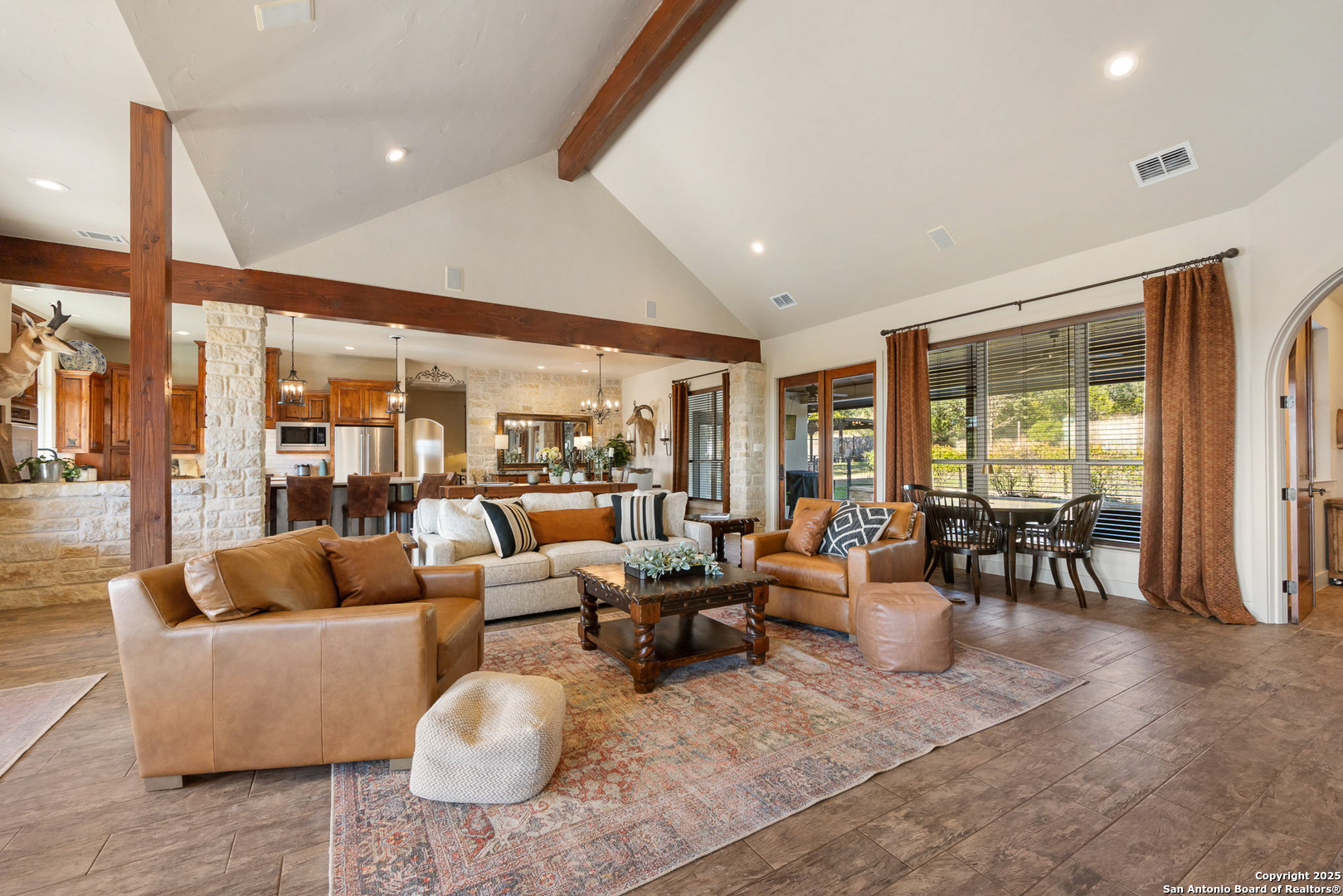 115 Spanish Pass Road Boerne, TX 78006 - Photo 12 of 50 a living room with furniture and large windows