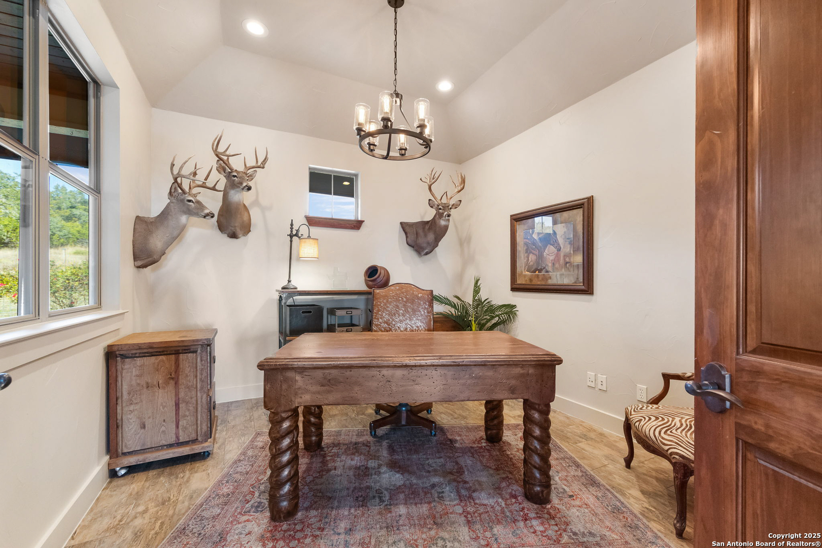 115 Spanish Pass Road Boerne, TX 78006 - Photo 14 of 50 a view of a dining room with furniture a chandelier and wooden floor