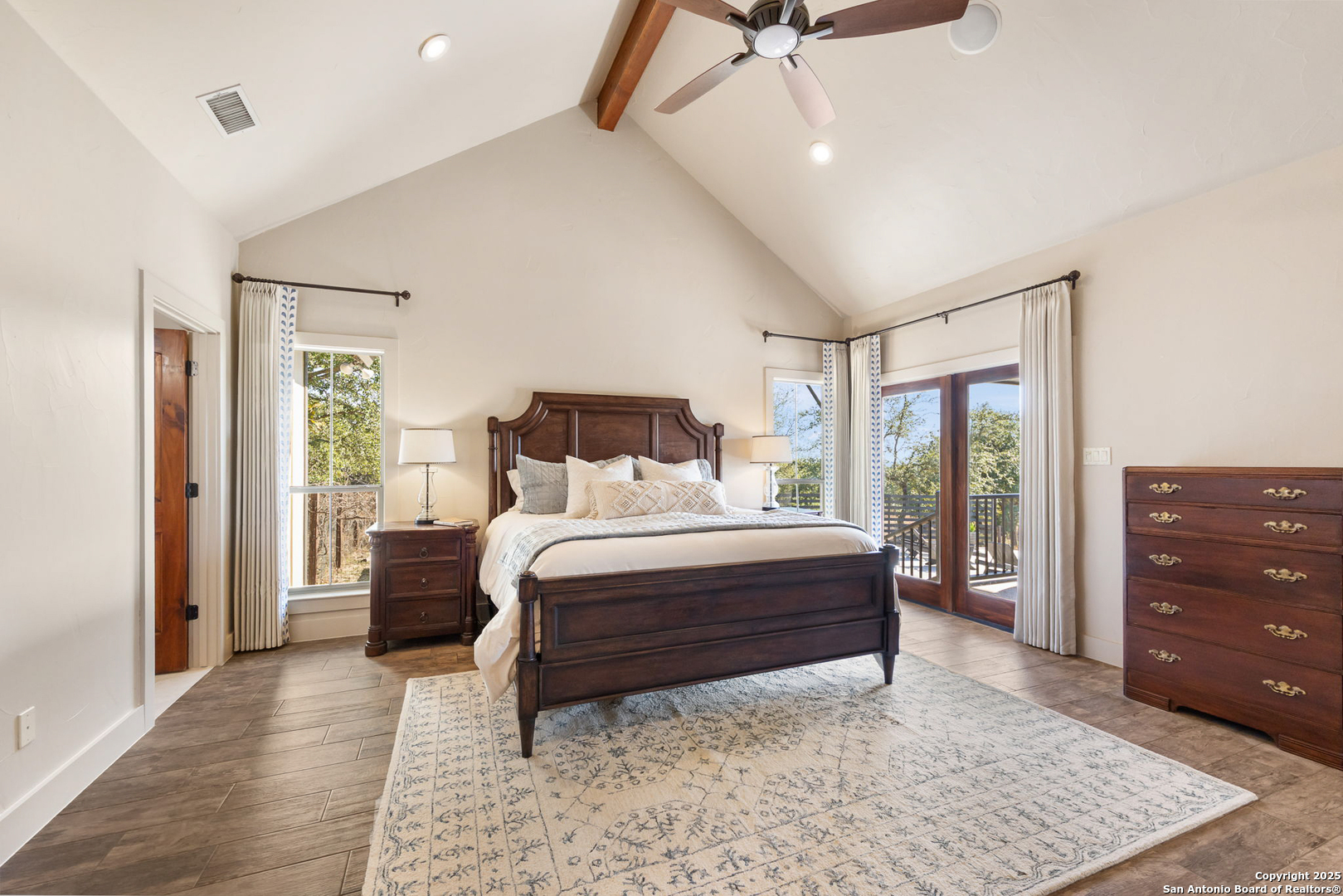 115 Spanish Pass Road Boerne, TX 78006 - Photo 16 of 50 a bedroom with a bed and wooden floor