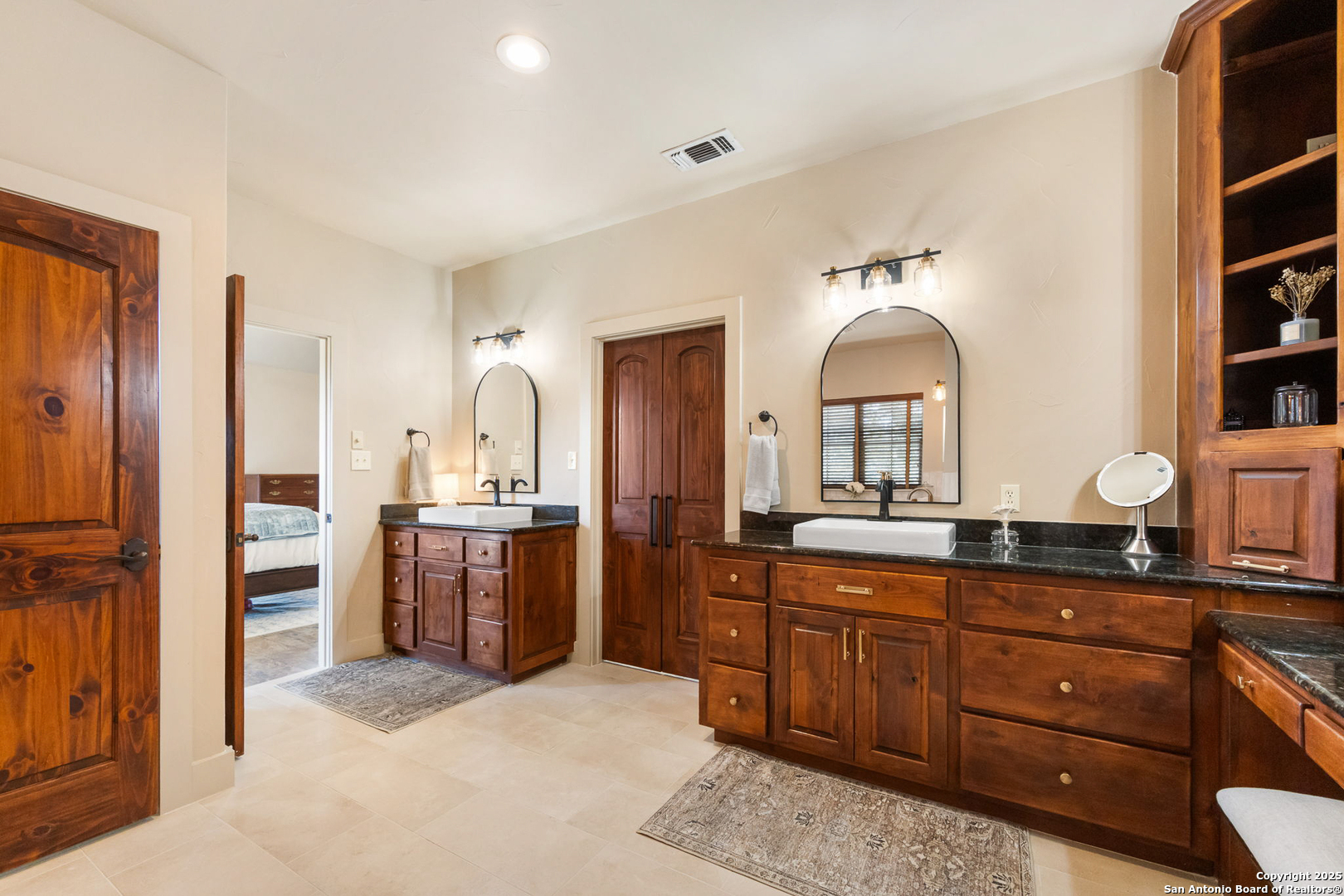115 Spanish Pass Road Boerne, TX 78006 - Photo 19 of 50 a spacious bathroom with a granite countertop sink mirror and