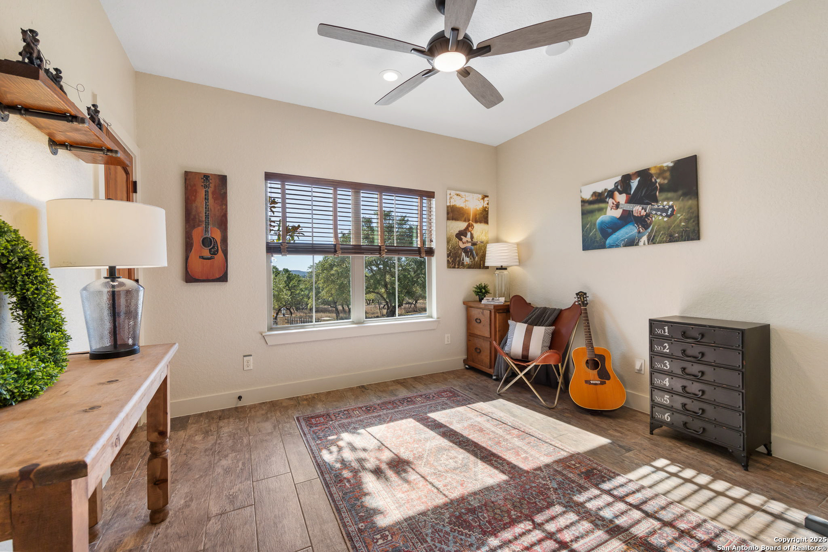 115 Spanish Pass Road Boerne, TX 78006 - Photo 21 of 50 a view of a workspace with furniture and a window