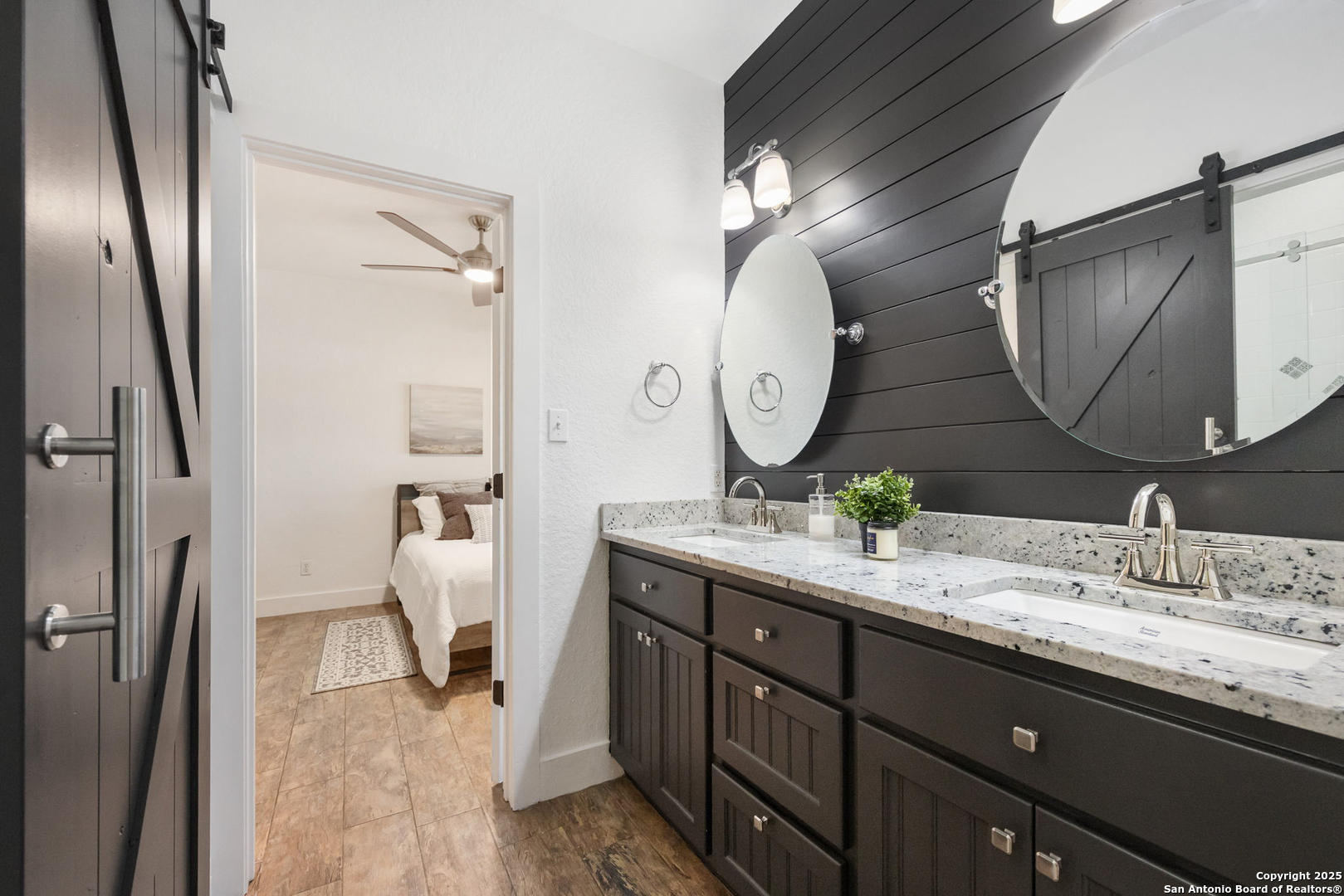 115 Spanish Pass Road Boerne, TX 78006 - Photo 25 of 50 a bathroom with a double vanity sink and a mirror