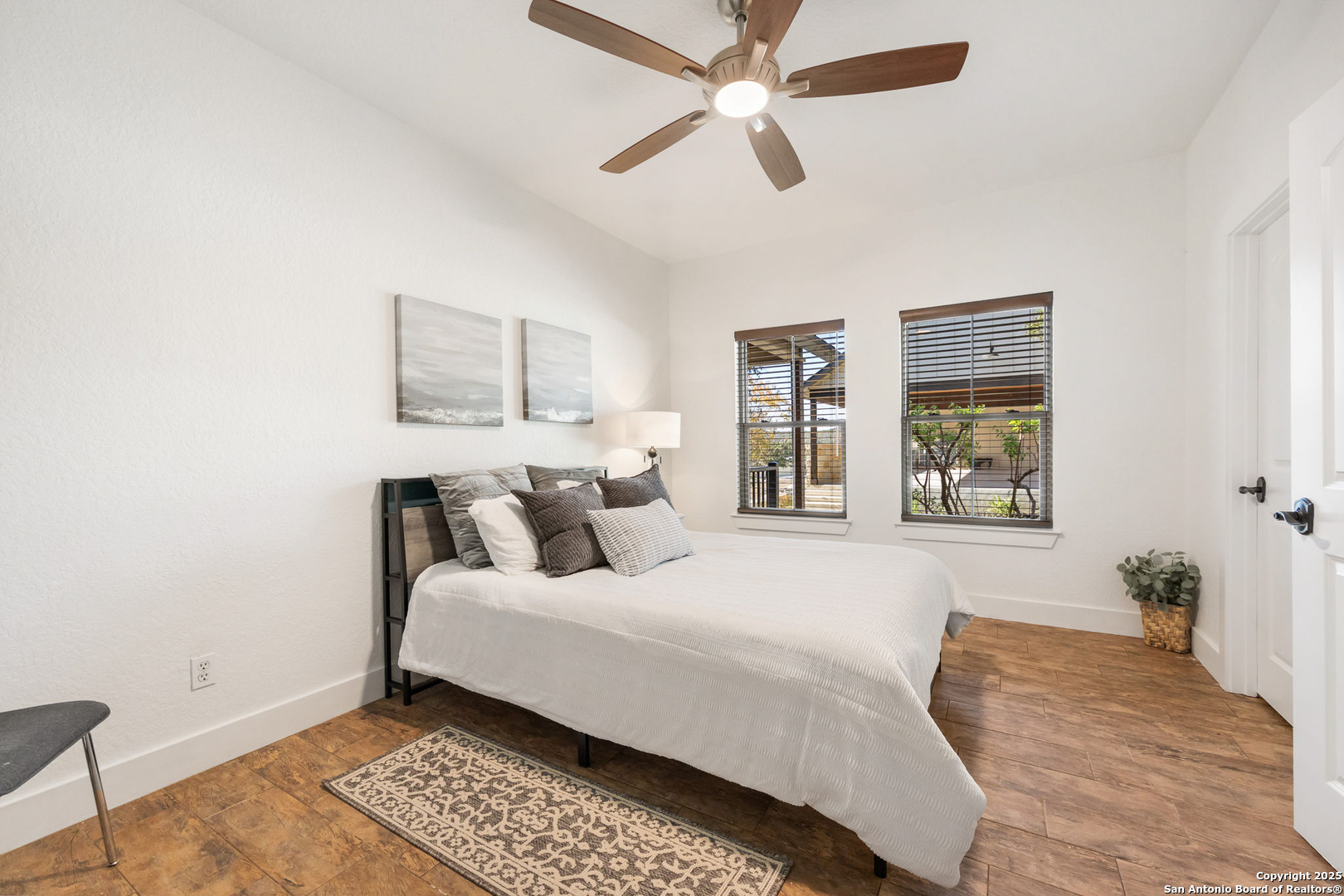 115 Spanish Pass Road Boerne, TX 78006 - Photo 27 of 50 a bedroom with a bed and a window