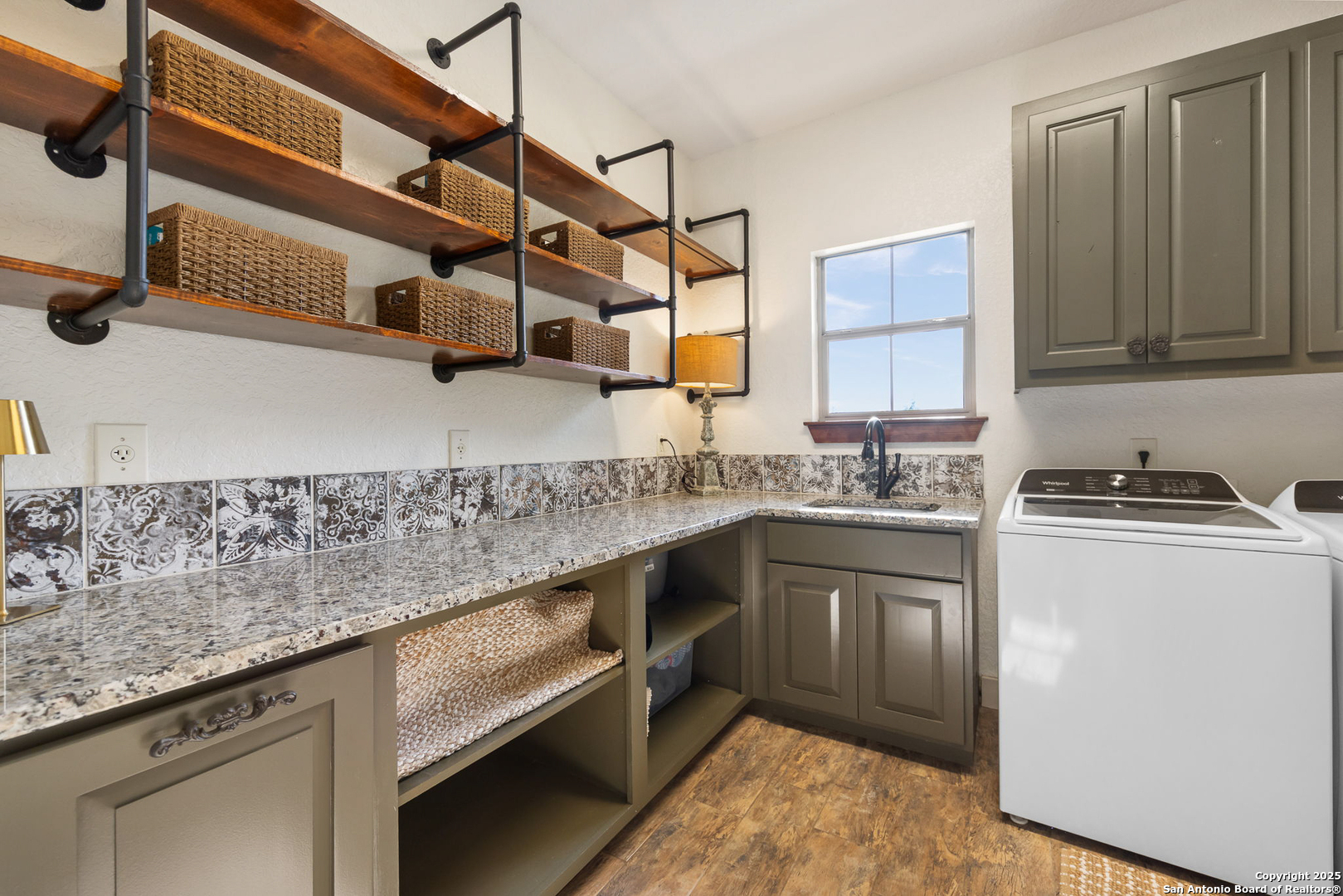 115 Spanish Pass Road Boerne, TX 78006 - Photo 28 of 50 a kitchen with stainless steel appliances granite countertop a sink a stove and cabinets