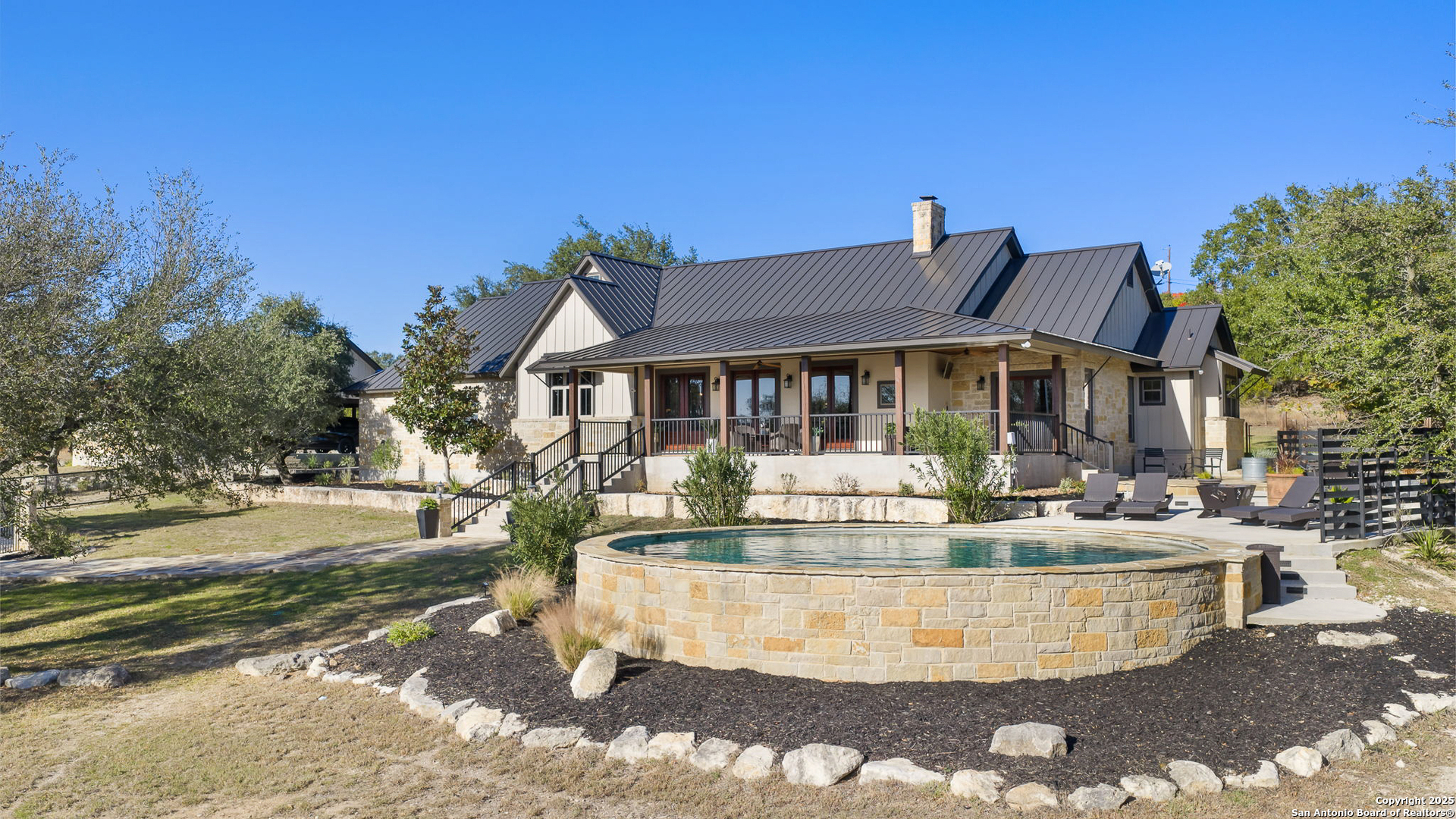 115 Spanish Pass Road Boerne, TX 78006 - Photo 30 of 50 a view of a house with pool and sitting area