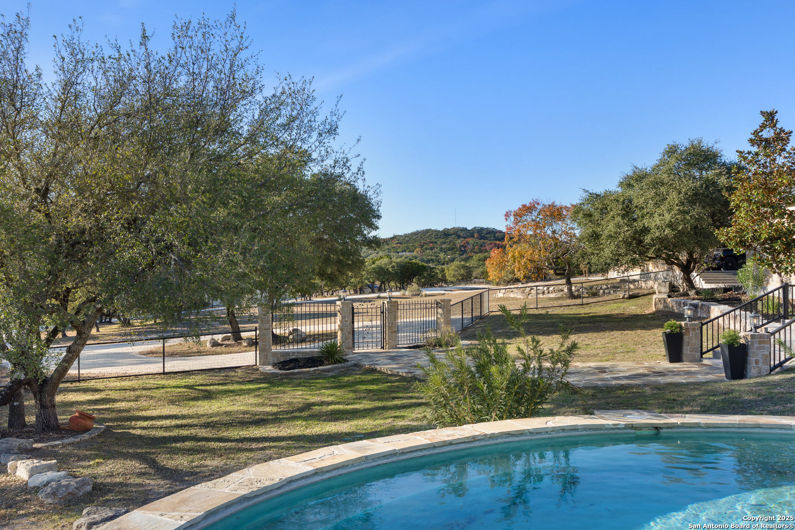 115 Spanish Pass Road Boerne, TX 78006 - Photo 31 of 50 a view of a swimming pool with a patio