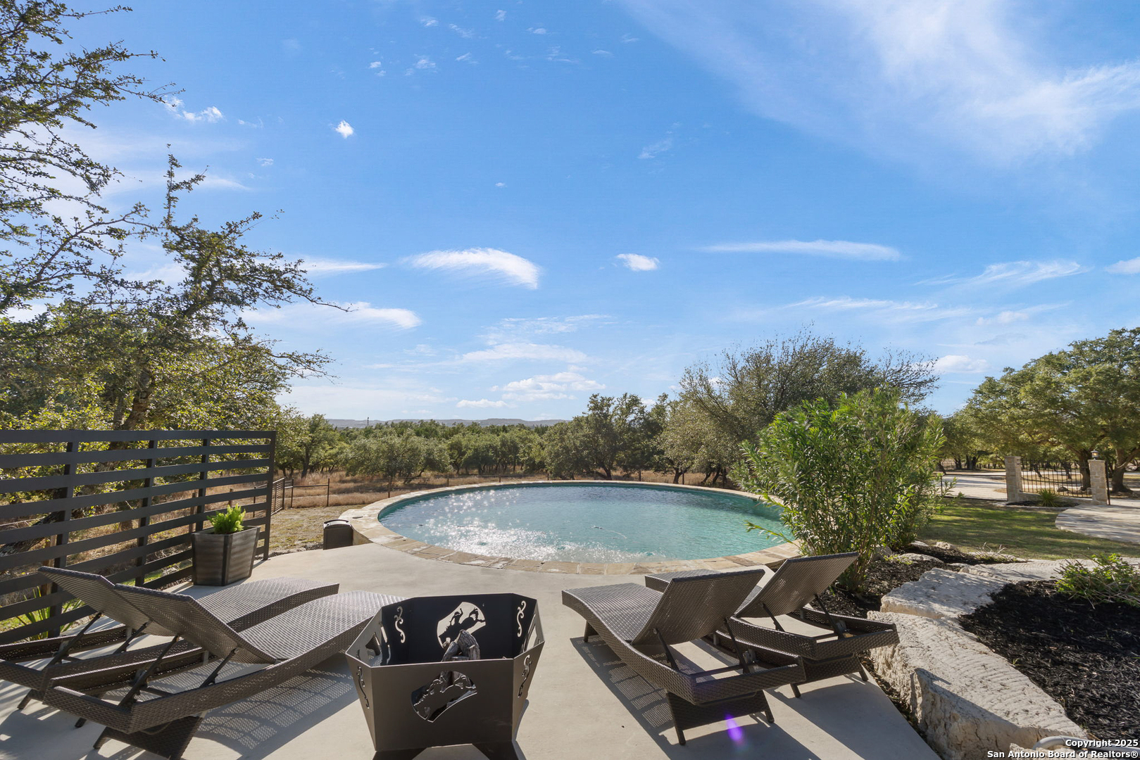 115 Spanish Pass Road Boerne, TX 78006 - Photo 36 of 50 a view of a terrace with furniture and a garden